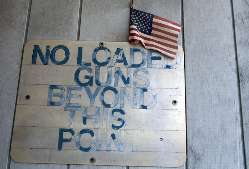 An entry sign is seen at Chris' Indoor Shooting Range in Guilford