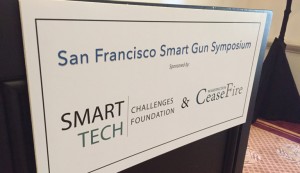 The sign on the podium at the San Francisco Smart Gun Symposium, which discussed advancement of the technology in the U.S. consumer market. (Photo: Daniel Terrill)