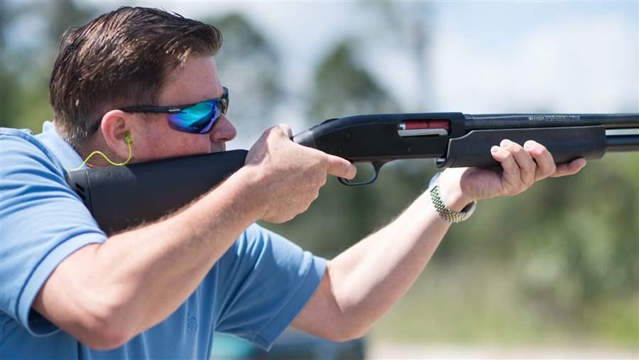 iGun Technology owner Jonathan Mossberg demonstrates his smart shotgun, which will only fire when in close proximity to a ring he is wearing. He would like to develop a smart handgun for the public, and so would some gun safety advocates. Credit: Associated Press